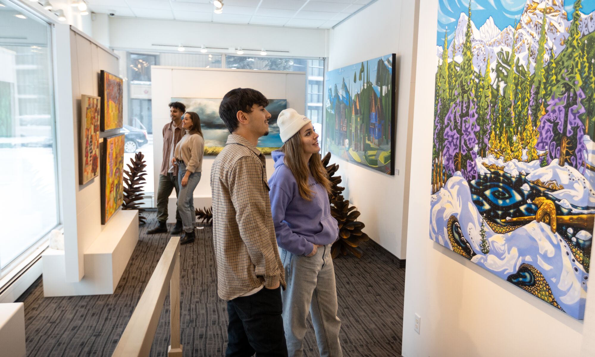 Friends explore the Canada House Gallery on Bear Street in the Banff Townsite.